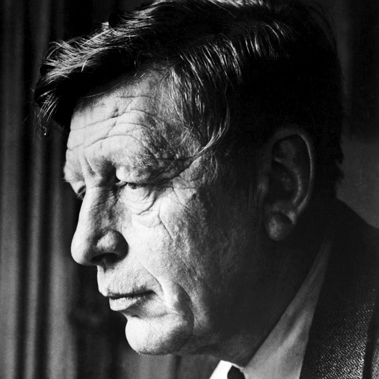 A headshot of an older man from the side.